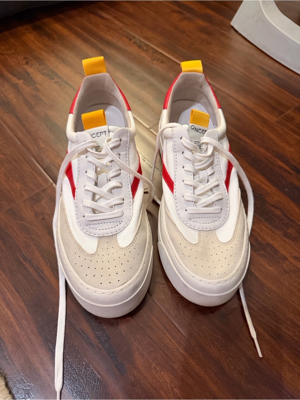 CONCEPT White Sneakers with Red and Yellow Accents